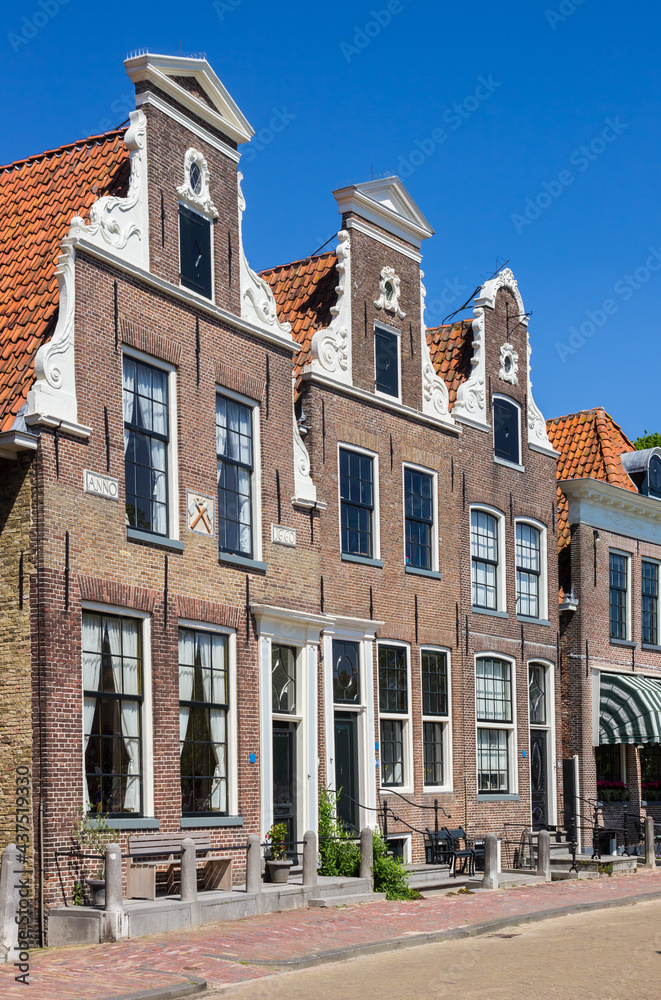 Fototapeta premium Decorated facades of historic houses at the inner harbor of Blokzijl, Netherlands