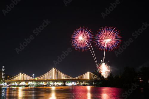 SURATTHANI, THAILAND - OCTOBER 17 : Beautiful firework display for celebration on the Tapee river on parades in Chak Phra Festival on October 17, 2015 in Suratthani, Thailand.