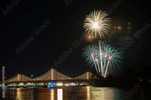 SURATTHANI, THAILAND - OCTOBER 17 : Beautiful firework display for celebration on the Tapee river on parades in Chak Phra Festival on October 17, 2015 in Suratthani, Thailand. © Somprasong