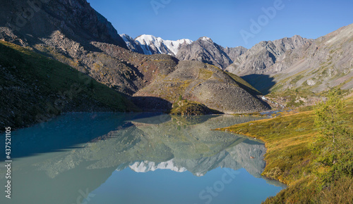 Scenic lake in the Altai Mountains, morning view. Traveling in the mountains.