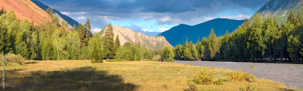 Evening light in the mountains, thunder sky, panorama landscape