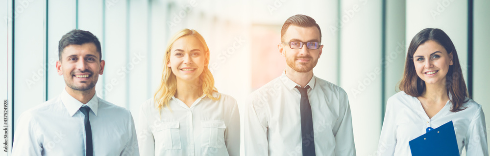 The business people walk in the office on the sunny background The business people walk in the office on the sunny background
