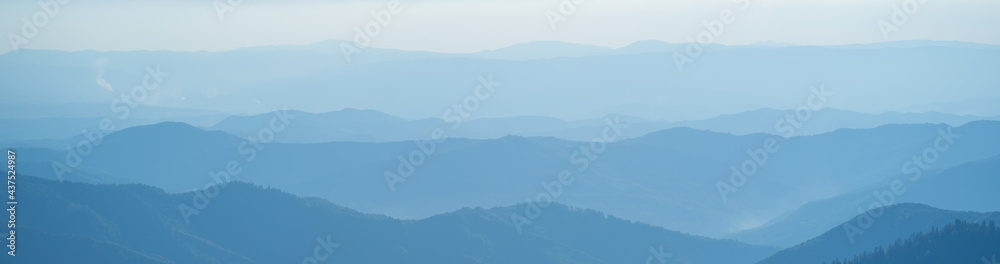 The picturesque foggy mountain landscape