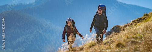 The young couple going to the mountain