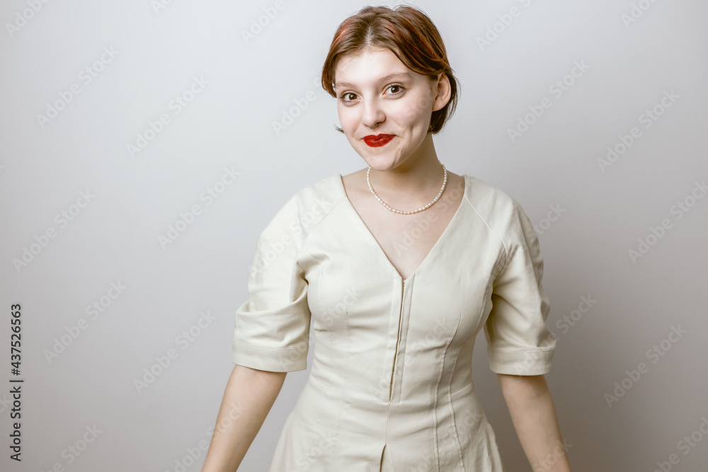 Cute girl smiling on a light background, close-up portrait Cute girl smiling on a light background, close-up portrait