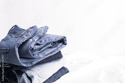 Denim clothes on a hanger. background