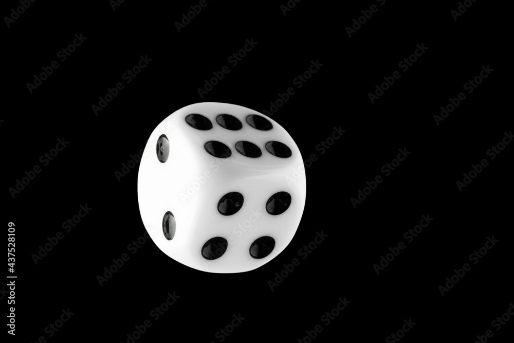the dice are black with white dots, isolated on a black background for clipping