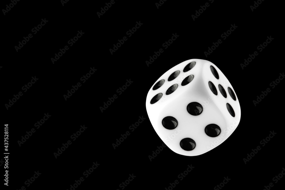 the dice are black with white dots, isolated on a black background for clipping the dice are black with white dots, isolated on a black background for clipping