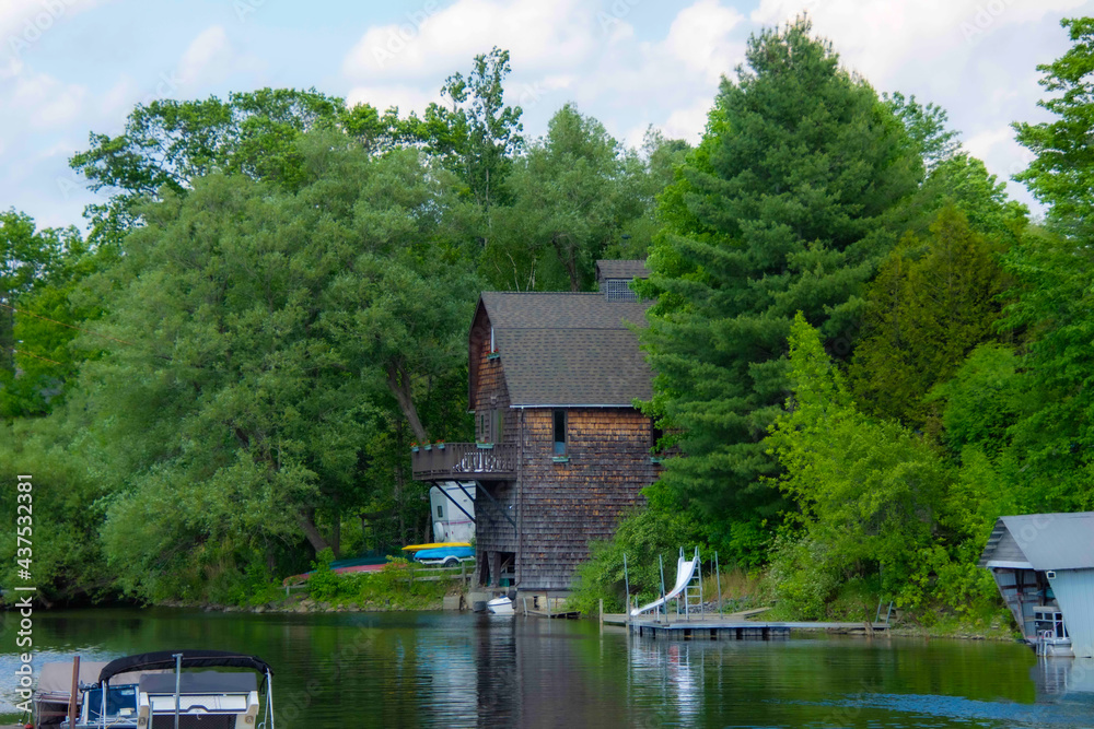 Fototapeta premium old house on the banks of a pretty river