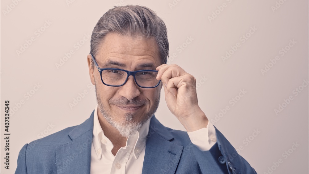 Business portrait - businessman smiling. Mature age, middle age, mid adult man in 50s with happy confident smile. Copy space. Business portrait - businessman smiling. Mature age, middle age, mid adult man in 50s with happy confident smile. Copy space.