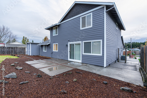 blue house with backyard