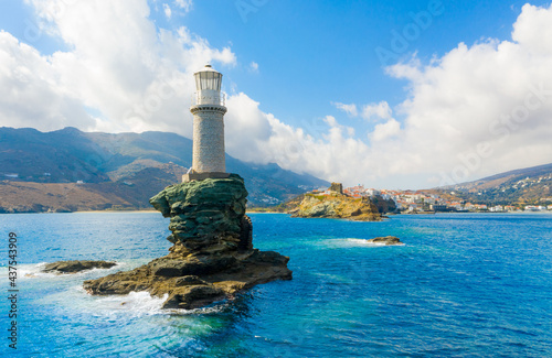 The beautiful Lighthouse Tourlitis of Chora at night. Andros island, Cyclades, Greece