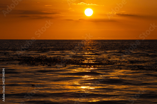 sunset in the middle of the sea © Ivan