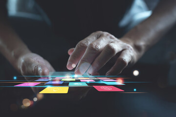 Man using smartphone with colourful mobile apps on virtual screen, digital software technology development concept