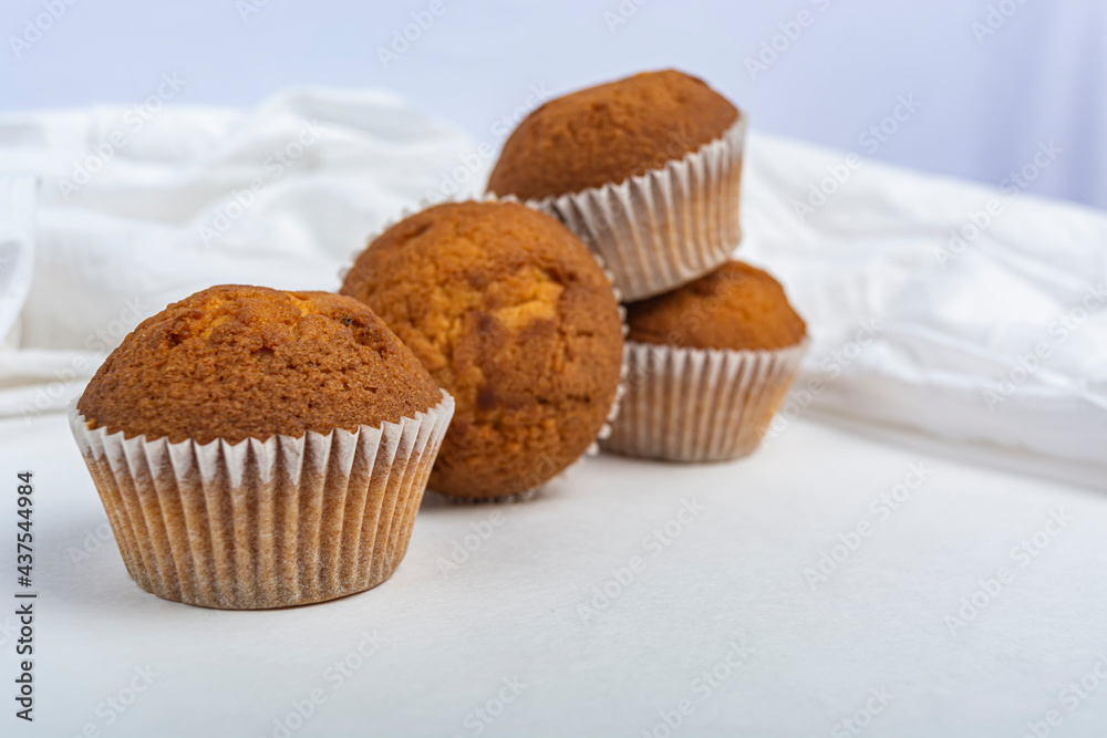 cupcakes against a white cloth copy space cupcakes against a white cloth copy space