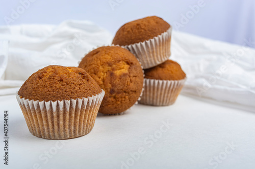 cupcakes against a white cloth copy space