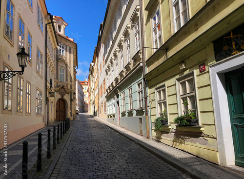 Fototapeta Naklejka Na Ścianę i Meble -  Looking up a typical old European street