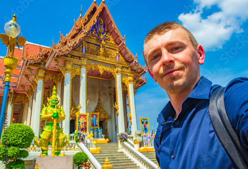 Tourists visit Wat Don Mueang Phra Arramluang temple Bangkok Thailand. photo