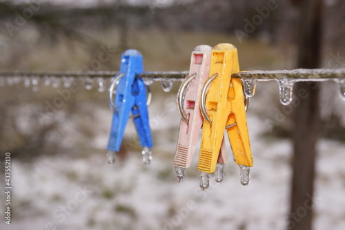 Iced clothespins on rope