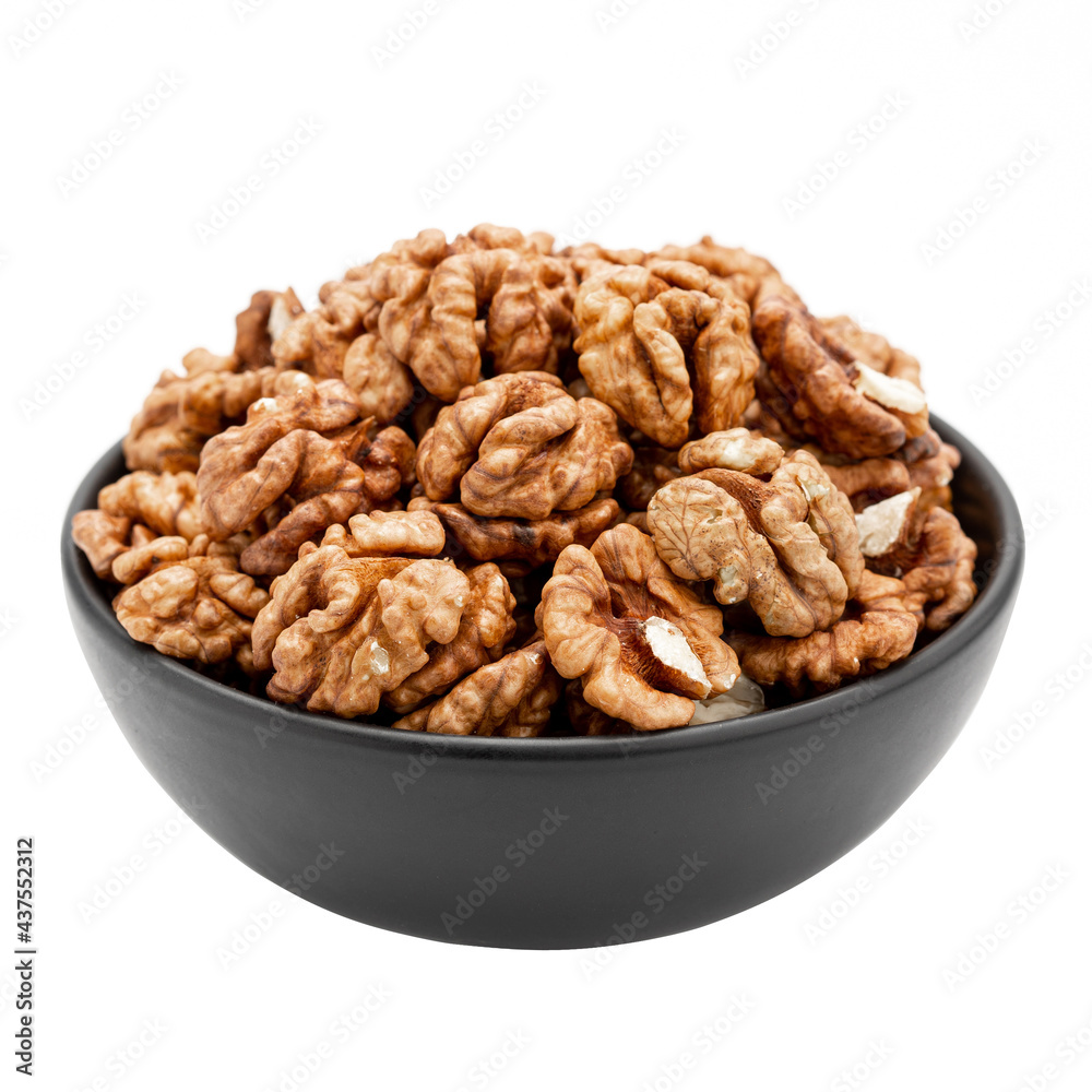 Peeled walnuts in a bowl isolated on a white background. Template for designers. Peeled walnuts in a bowl isolated on a white background. Template for designers.
