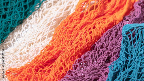 The banner of multi-colored string shoppers pattern was shot in macro style. Bright colors for your eco-friendly design.