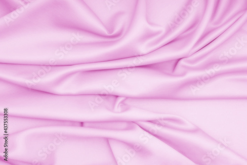 Smooth pink cloth, silk, fabric, satin texture background.