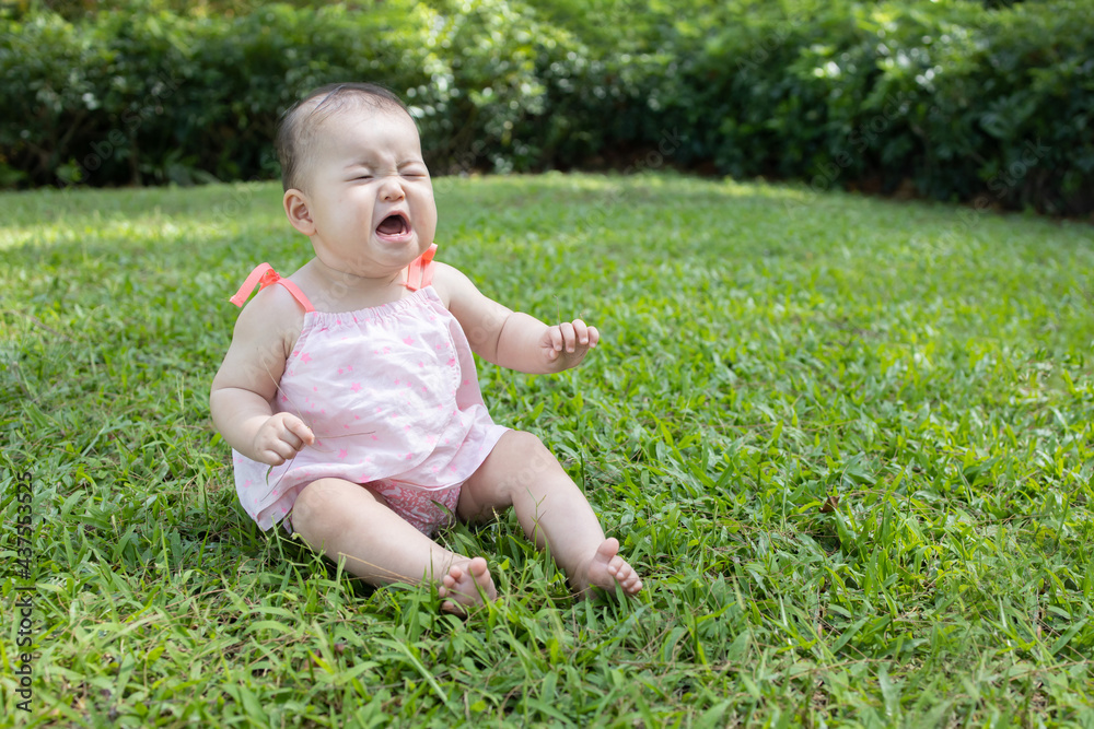 Baby Crying on Green Grass Baby Crying on Green Grass