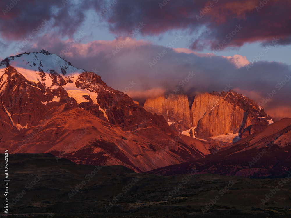 Red Sunset in the Andes Mountains. Landscape with Morning Andes, Chile. Top of the Mount Torres del Paine Covered by Clouds. Snow Lying on the Slope of the Mountain.