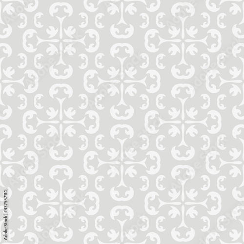 Monochrome background pattern with white ornament on a light gray background, wallpaper. Seamless pattern, texture