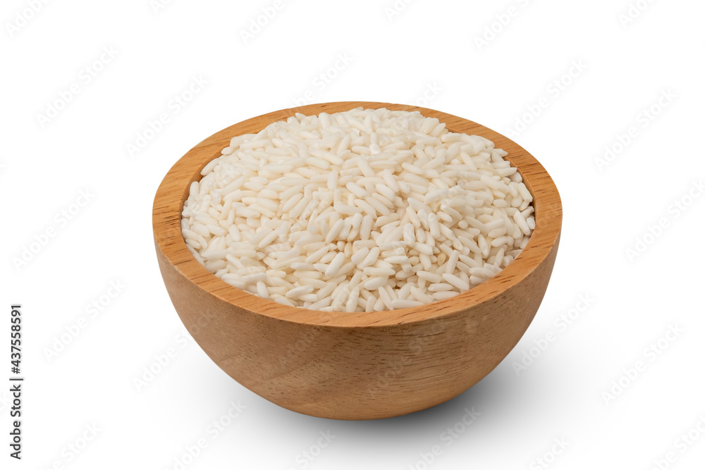 uncooked Thai sticky rice in wooden bowl isolated on white background with Clipping Path