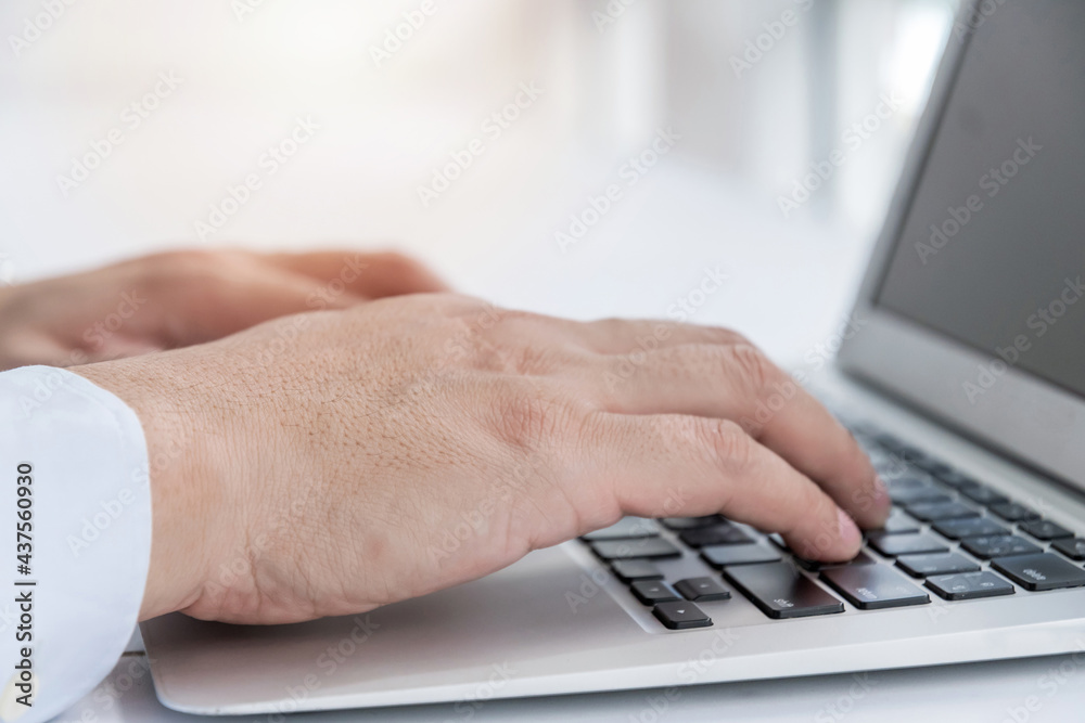 businessman hand working on laptop computer on desk at home office, work from home, searching web, social network, online, business strategy, finance, investment and digital technology concept businessman hand working on laptop computer on desk at home office, work from home, searching web, social network, online, business strategy, finance, investment and digital technology concept