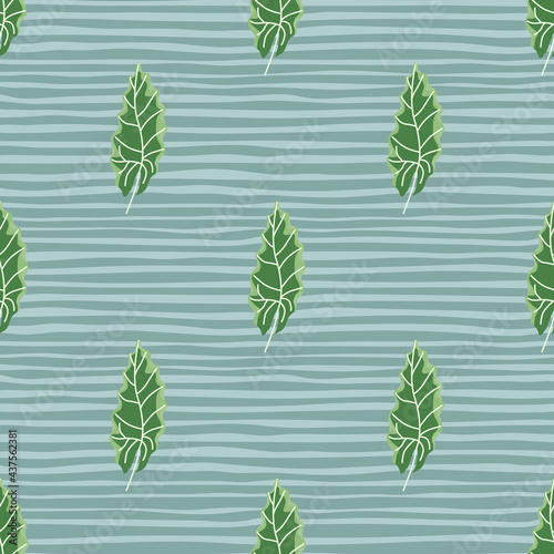 Decorative seamless pattern with bright green autumn oak leaves print. Blue striped background.