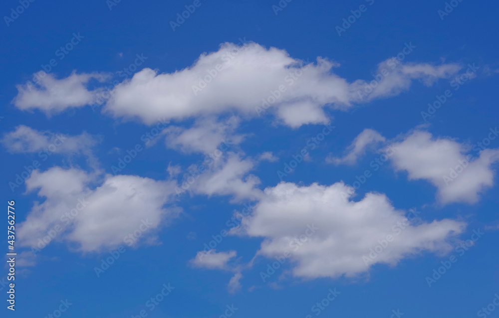 White clouds in the blue sky.