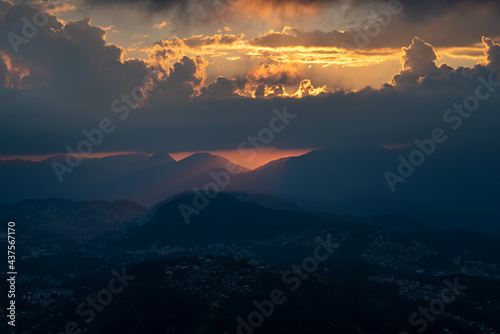 Colorful sunset on top of brazilian mountain - Castelinho, Petropolis, Rio de Janeiro, Brazil photo