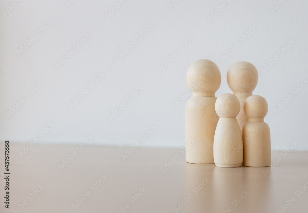 Group of wooden figures, father mother daughter, and son, family concepts Group of wooden figures, father mother daughter, and son, family concepts