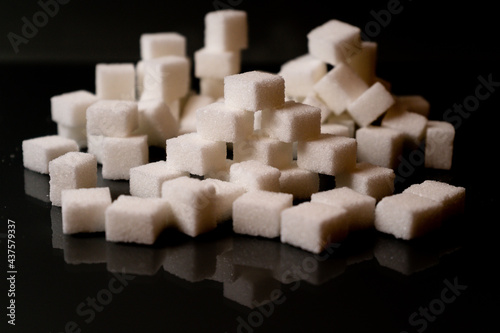Sugar cubes in different arrangements and colored light. Bavaria Germany . Arrow  Pile  Cube  Square 