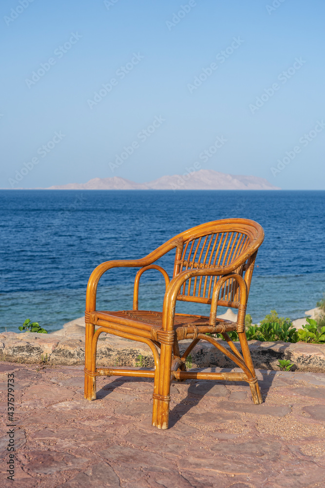 Rattan chair on the tropical beach near the sea in Sharm El Sheikh, Egypt Rattan chair on the tropical beach near the sea in Sharm El Sheikh, Egypt