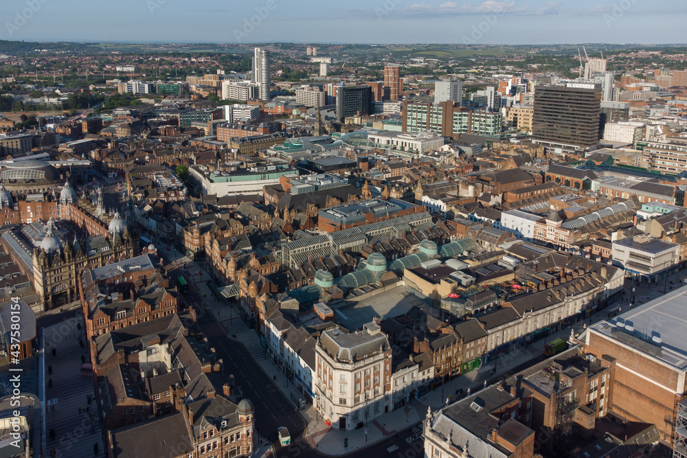 Leeds City Centre in Yorkshire. Aerial view of the retail shopping area, offices and hotels looking south on a sunny day to Bridgewater place and the train station. 