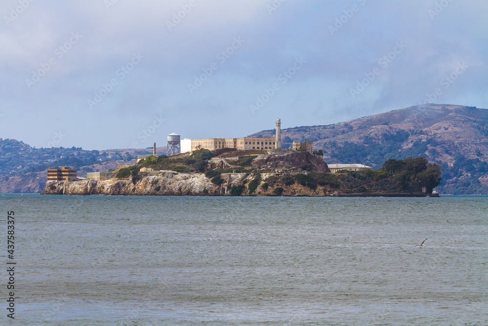 Close up image of the Alcatraz Cellhouse and lighthouse seen from Pier 39