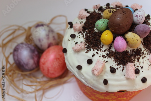 Happy easter cake with eggs. Chocolate kulich with decoration.