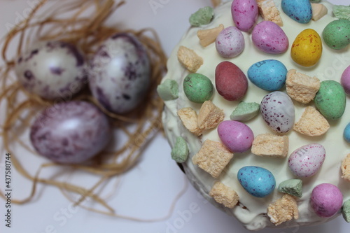 Decoration easter cake with easter eggs on white background. Easter day. Yummy celebration. Gourmet cake.