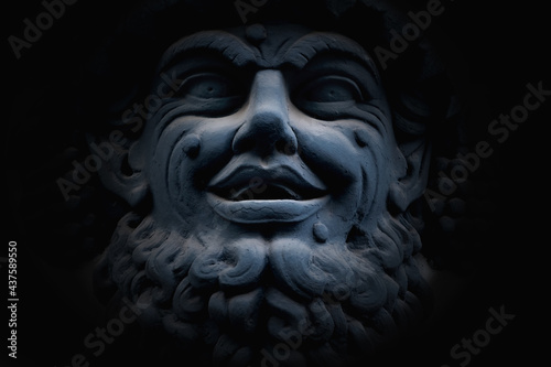 Ancient statue of god of wine, fun and entertainment Bacchus (Dionysus). Fragment.