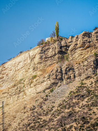 A lonely house on a cliff. Authentic Dagestani mountain village of Gunib. Russia. photo