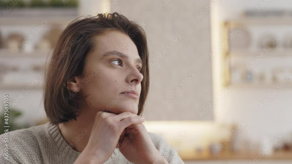 Pretty woman looking aside during self education at home Pretty woman looking aside during self education at home