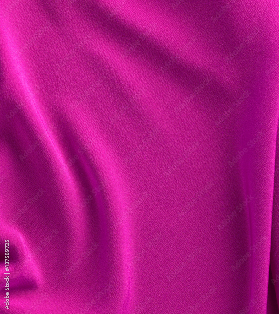 Fototapeta premium fuchsia satin fabric with soft folds, top view