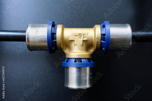 Multipurpose press fitting for multilayer pipes placed on a stand. Plumbing equipment