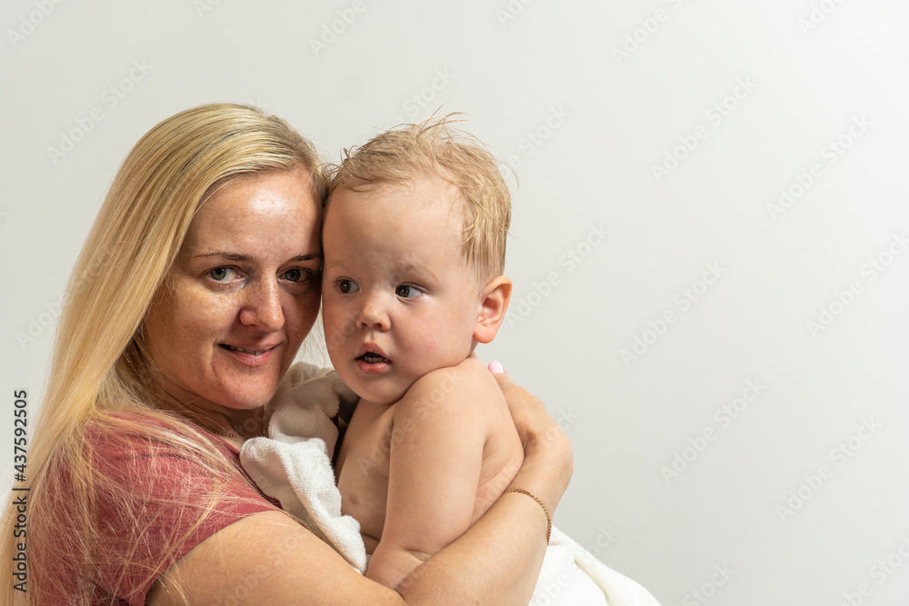 Mom and son with blond hair after bathing Mom and son with blond hair after bathing