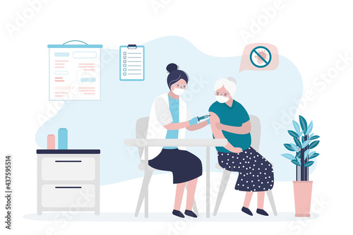 Nurse giving coronavirus vaccine to elderly patient. Doctor makes injection of medication. Grandmother vaccinated against coronavirus. .