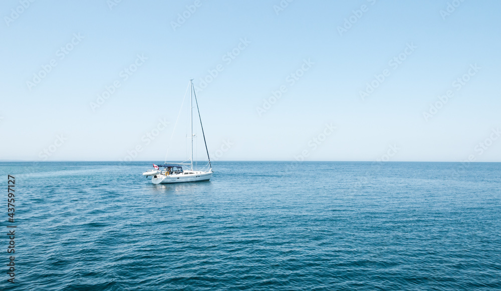 A sailboat going for a cruise in Bruce Peninsula, Ontario, Canada.
