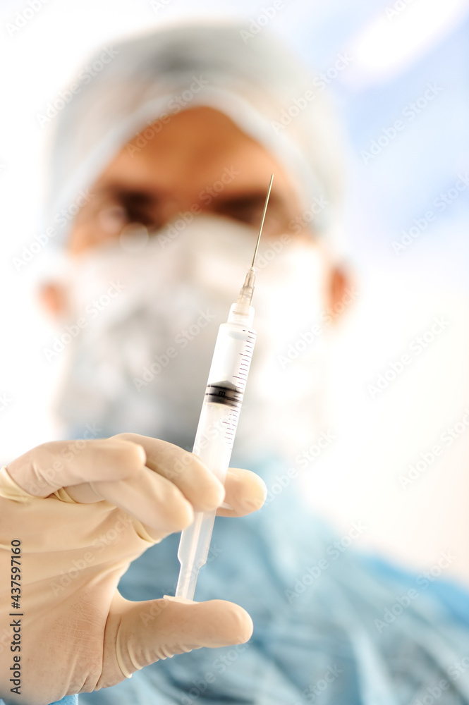 Doctor holding injection vaccine Doctor holding injection vaccine